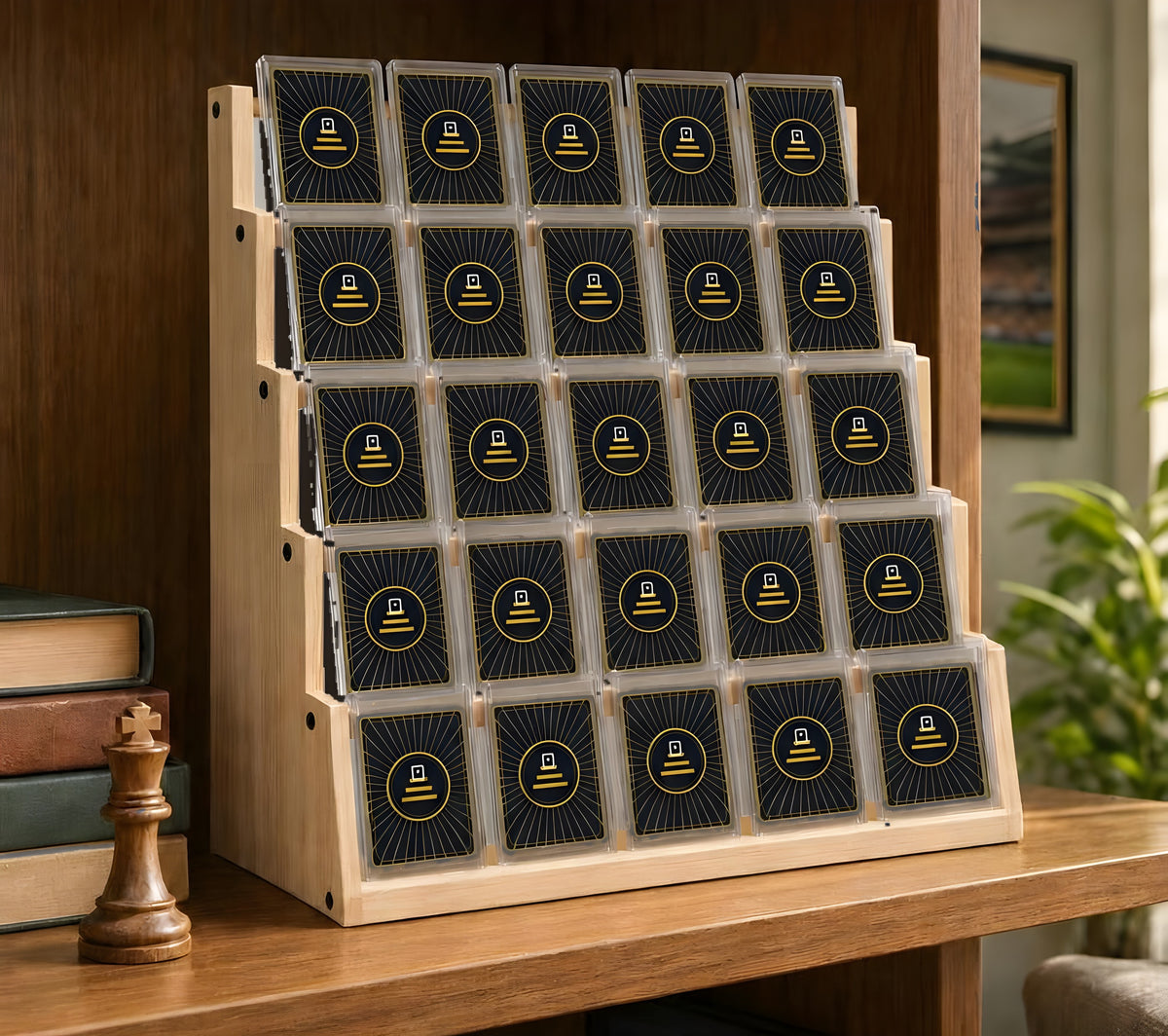 The Collector's Shelf solid pine graded card display stand on a bookshelf, holding 25 graded cards